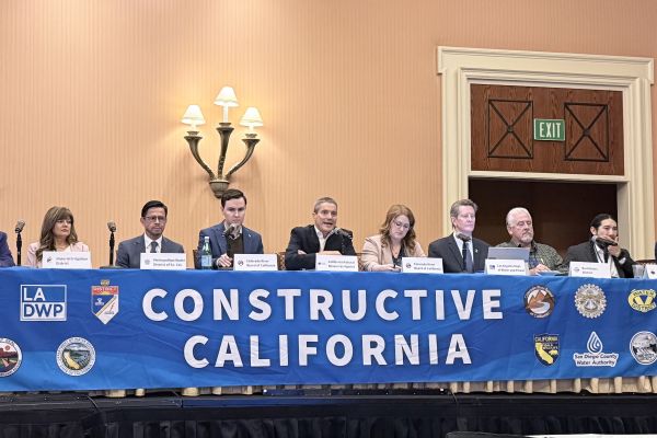 Several panelists speaking above a banner reading "Constructive California"